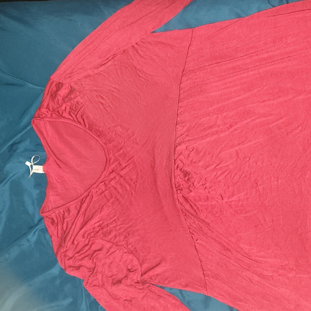 A red dress. Maybe a dress shirt. Size XXL. Naggoo brand.